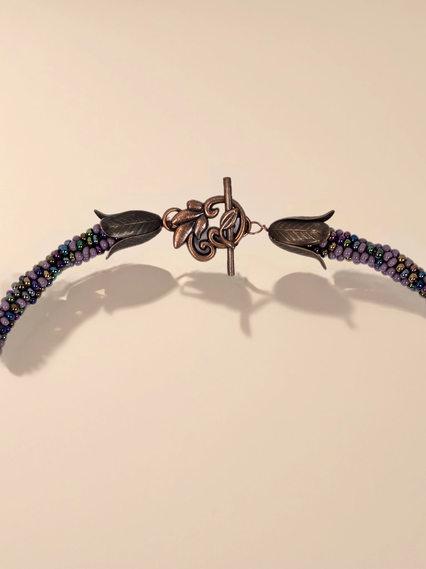 Beaded Necklace 20" With 2" Lava Star Pendant Butterfly Accent and Antique Copper Floral Toggle Clasp
