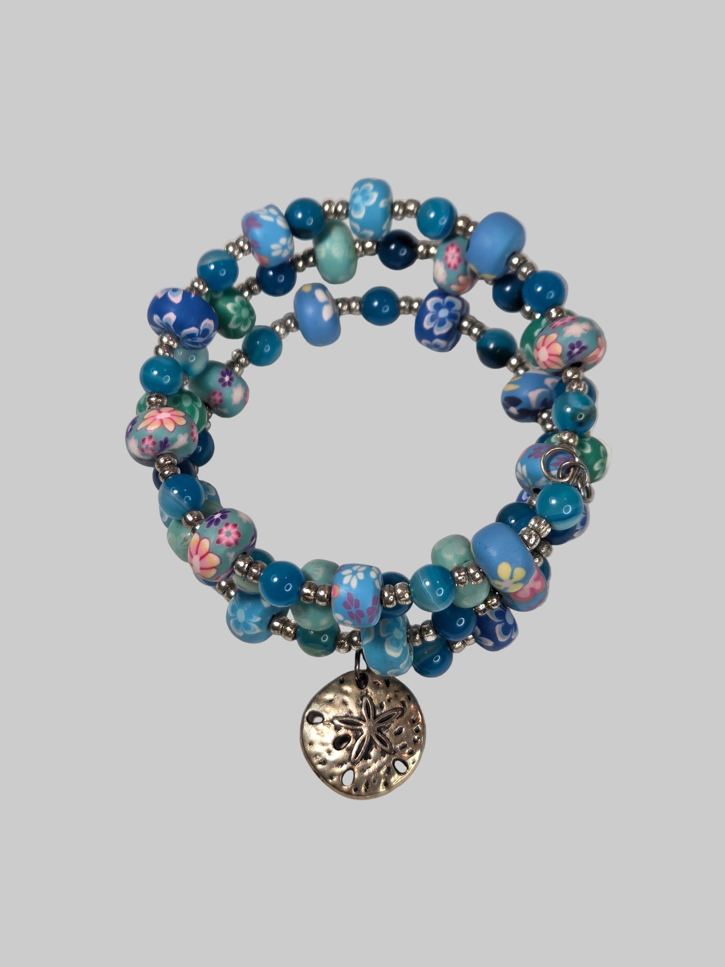 Bracelet with Floral Ceramic Beads and Silver Beads with Starfish Dangle