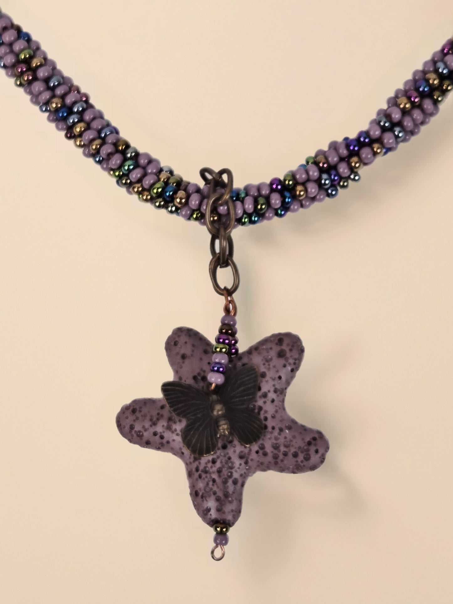 Beaded Necklace 20" With 2" Lava Star Pendant Butterfly Accent and Antique Copper Floral Toggle Clasp