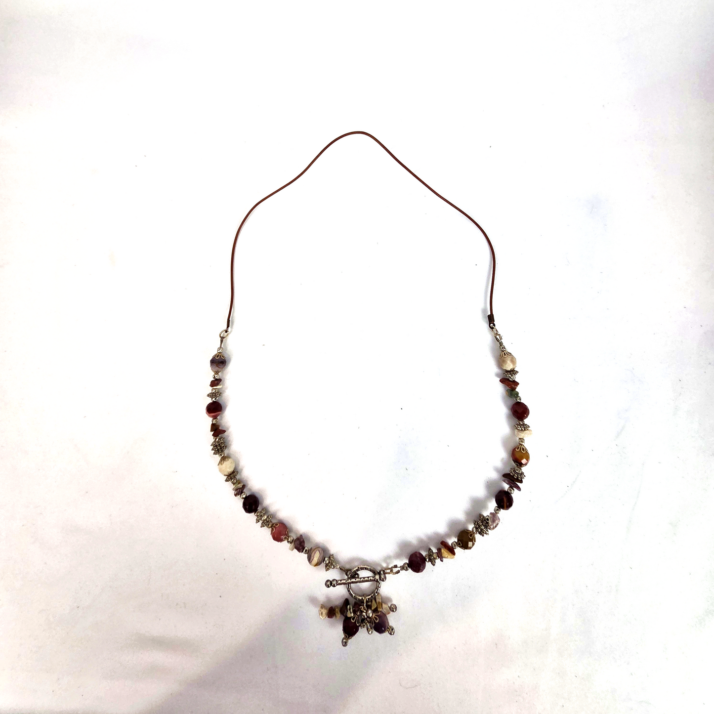 Jasper Beaded Necklace and Leather with Silver Tone Toggle Clasp Accented with a Cascade Cluster of Charm Drops